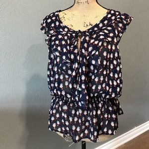 Daniel Rainn songbird sleeveless shirt.